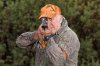 12866177-senior-hunter-holding-a-rifle-in-a-shooting-position.jpg