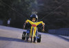 boy-with-helmet-riding-plastic-trike-20034.jpg