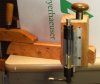 Case trimmer bench mounted vertically with hadle improvement on top and bottom.jpg