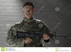 young-soldier-holding-assault-rifle-horizontal-military-man-dark-room-35334195.jpg