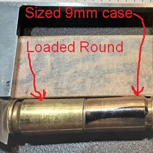 9mm OAL  Case head to bullet ogive.
